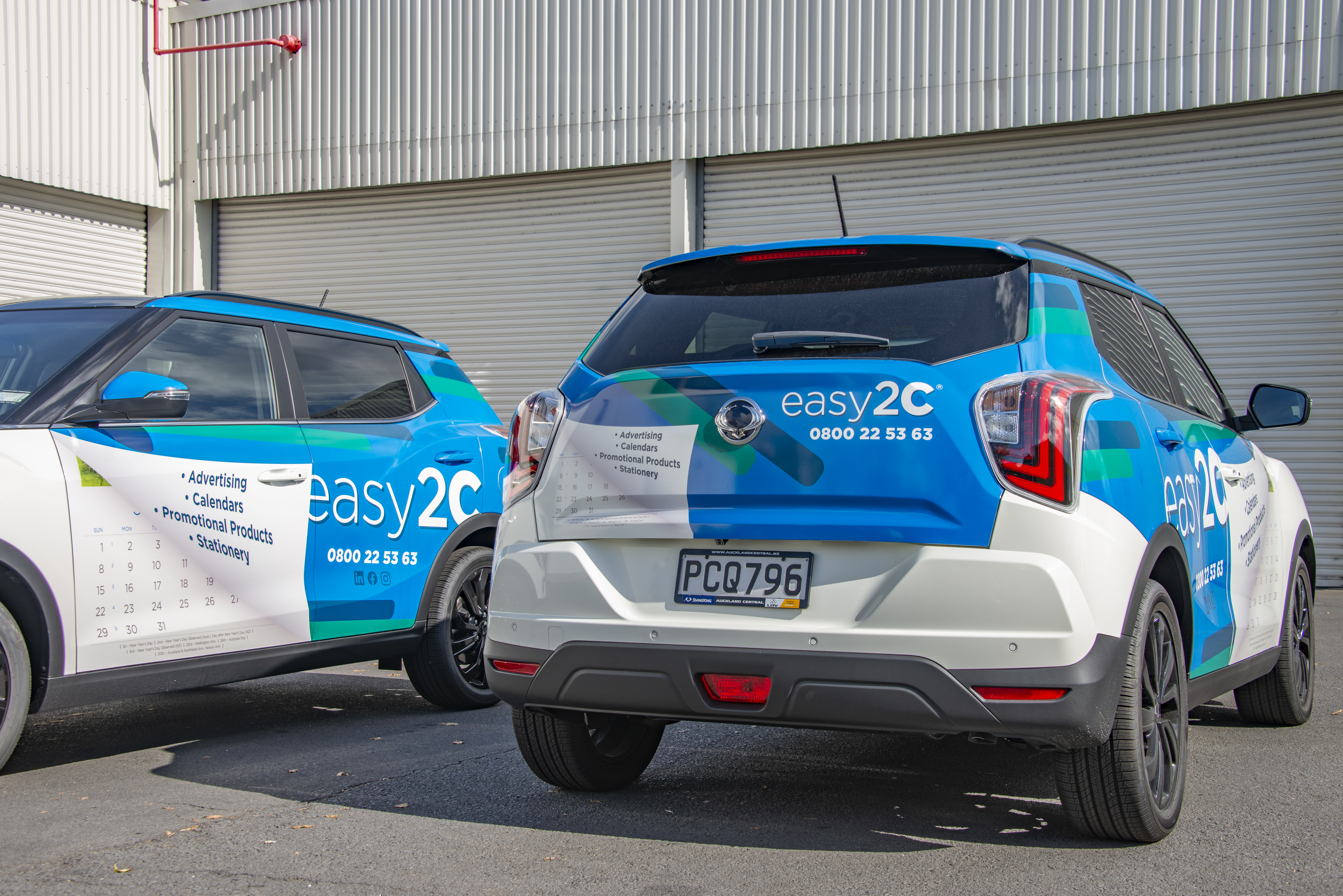 Two Easy2C branded vehicles